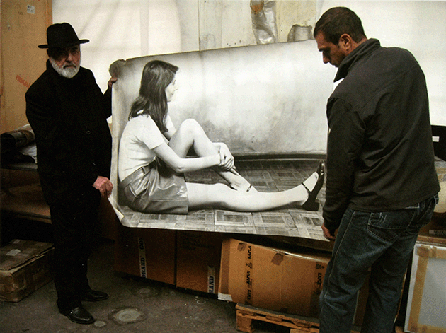 The artist and Alessandro Lacirasella holding the photographic enlargement used for the velina figure for the creation of the present work, Cittadellarte-Fondazione Pistoletto, Biella, 2009. Photographed by Suzanne Penn.